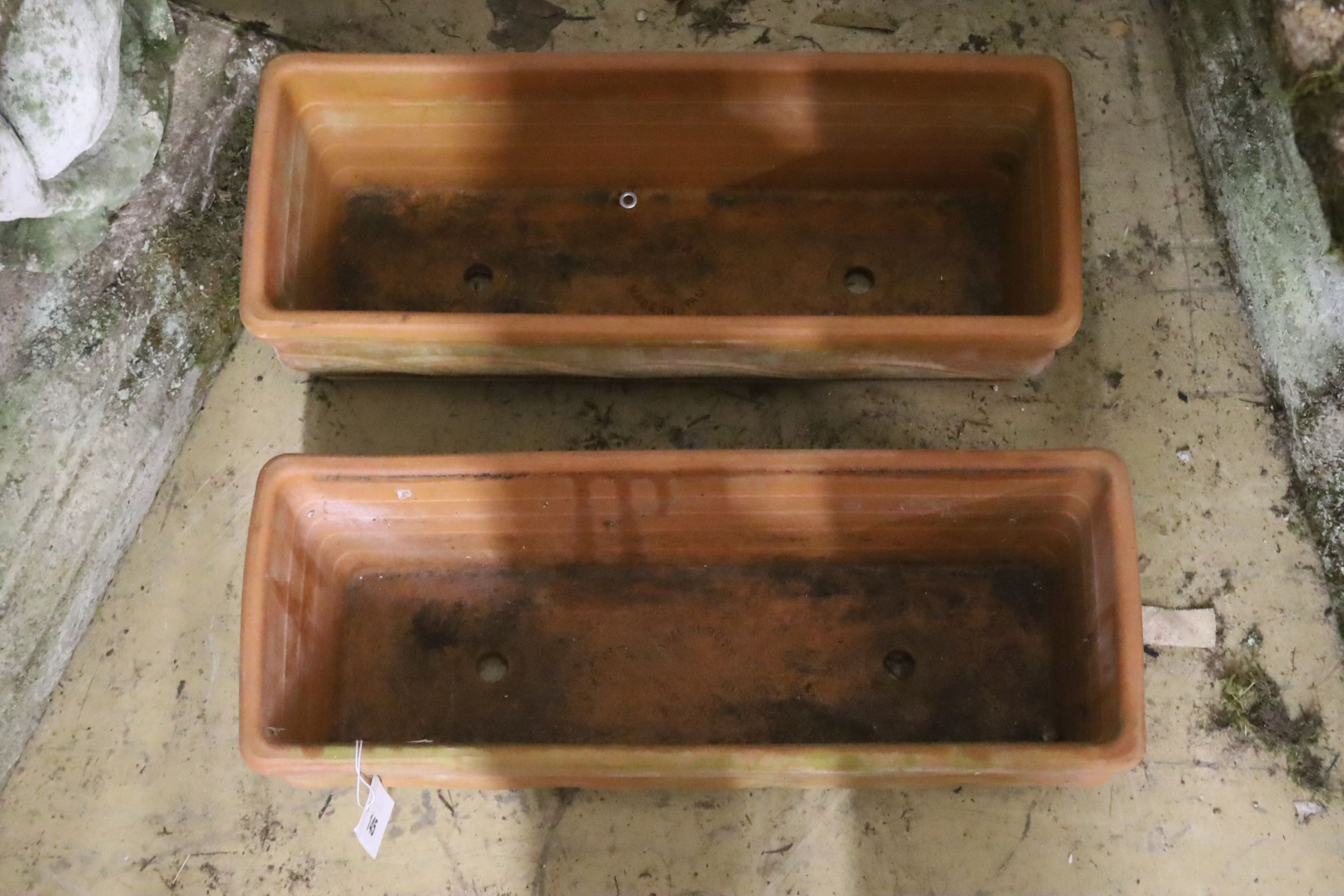 A pair of small rectangular terracotta garden planters, width 50cm, depth 18cm, height 15cm